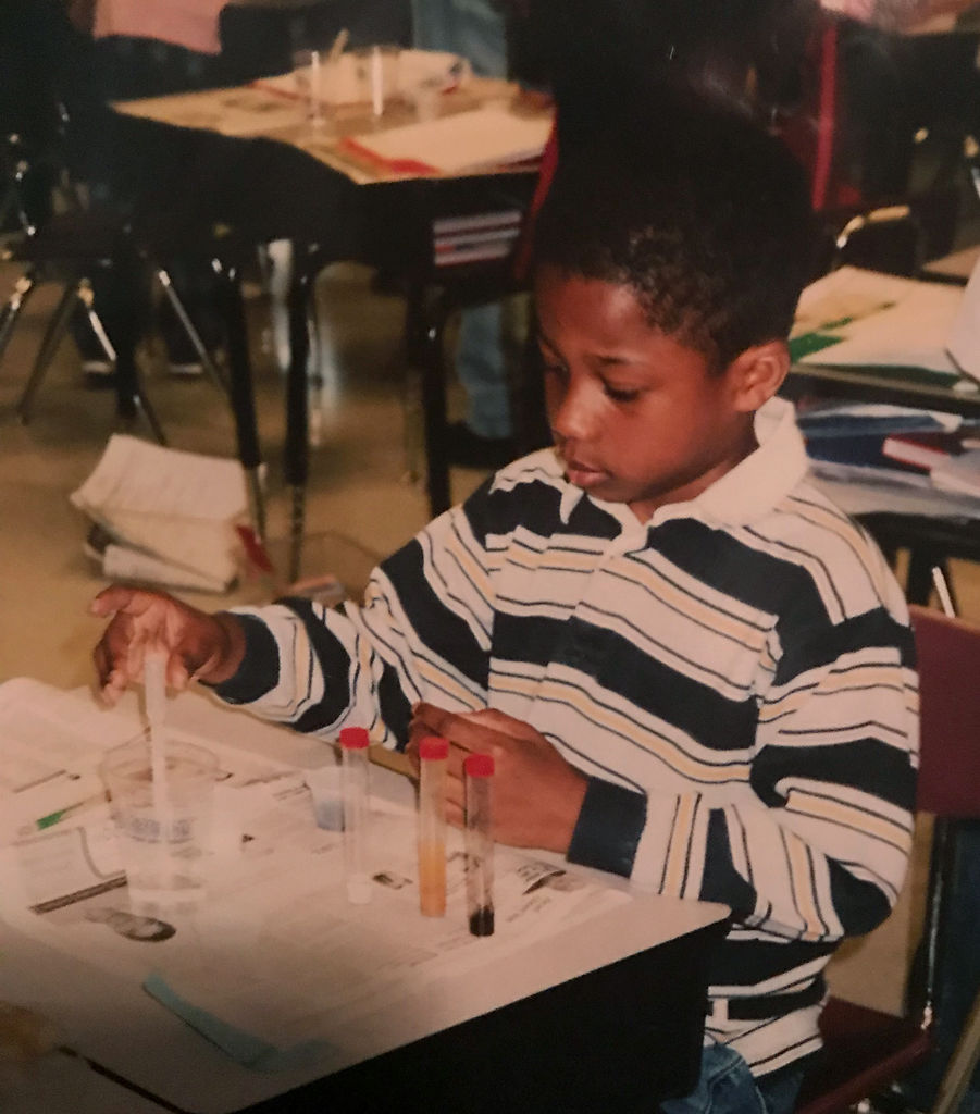 Finis Stribling IV does a science experiment in elementary school